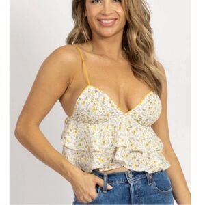 yellow ruffle tank top. Item being sold is the one in the last two pictures.
